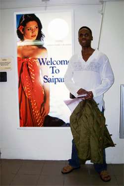Walt in Saipan. Posing in front of Welcome to Saipan poster at Saipan airport