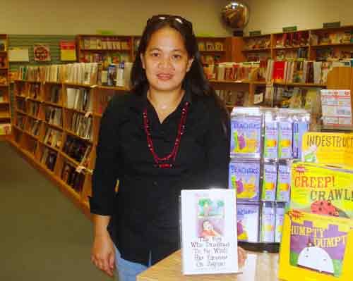 riza ramos and her book, the boy who dreamed to be with his parents on saipan at bestseller books on saipan